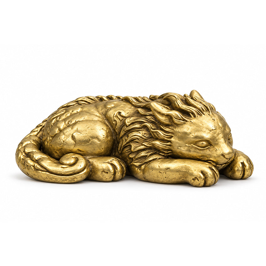 Side view of the gold-toned Qilin brass paperweight showing its textured body and coiled tail.