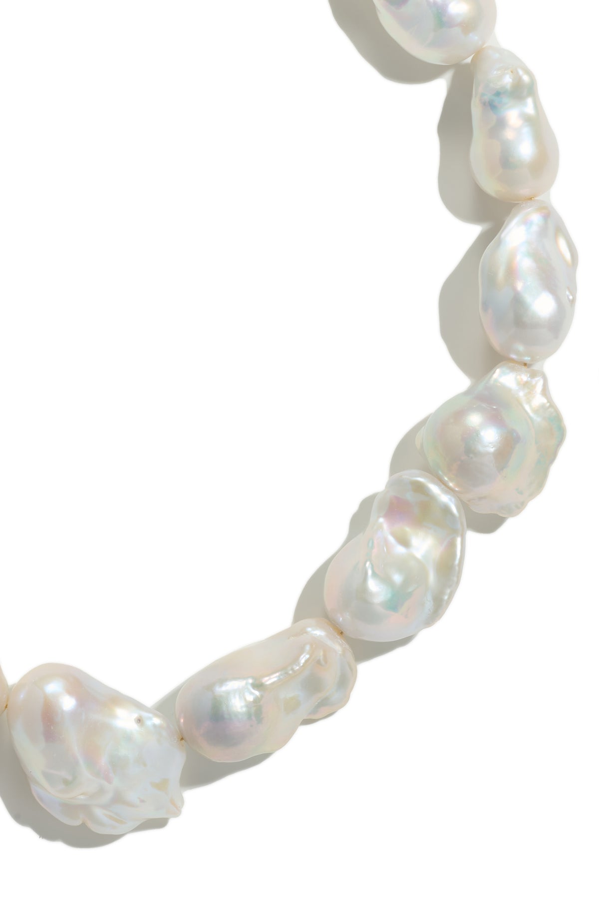 Close-up of the irregular shapes and lustre of the Organic Muse Baroque Pearl Necklace